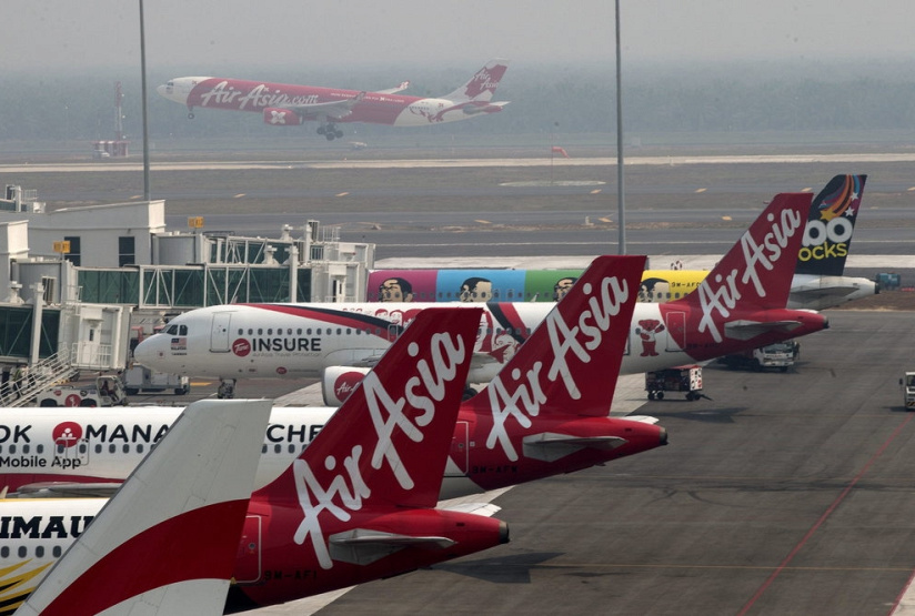 Wegen Quartalsverlust: Air Asia kürzt Kapazitäten, © dpa/Ahmad Yusni/EPA